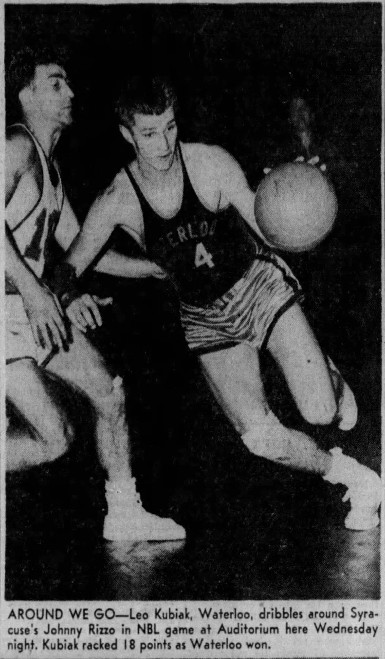 Leo Kubiak of the Waterloo Hawks drives past Syracuse's Johnny Rizzo in an NBL game